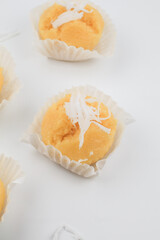 Toddy Palm Cake with coconut (Kanom Tarn) made from rice flour, palm oil, sugar and salt on white background, Thai dessert sweet taste delicious.