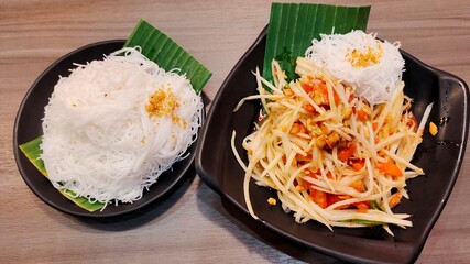 Thai food in the plate on the table.