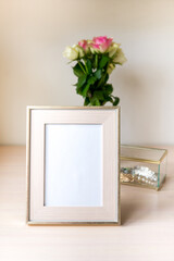 Portrait white with gold picture frame mockup and jewelry box