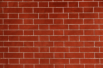 Brick wall is bright red, texture of stone blocks, background of bricks.