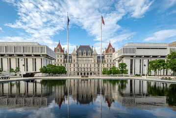 Fototapeta na wymiar Albany, NY - USA - May 22, 2021: view of the historic New York State Capitol with reflections in the Empire State Plaza's reflecting pools