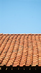 Orange roof tiles with blue sky background
