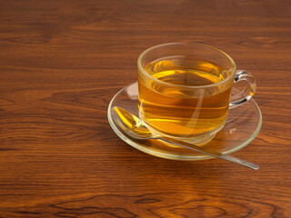 Teacup on a wooden table. Space for text. Morning beverage and relaxation concept