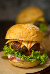 Close up shot of ready to eat homemade beef hamburger with fresh vegetables