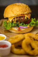 Close up shot of ready to eat homemade beef hamburger with fresh vegetables