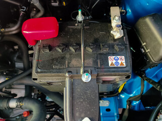 Malaysia, Perak, 16 May 2021: Battery on the new PRODUA ALZA car. Shot were noise and artifacts.