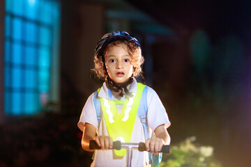 Safety on dark street. Kids reflective vest.