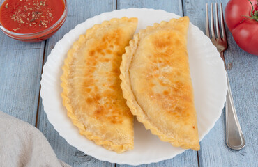 Fried pies with meat - Chebureks in a plate © Svetlana Rey