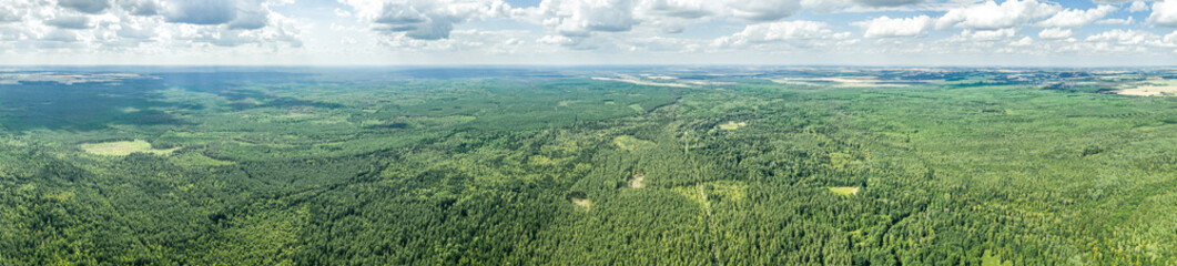 summer rural landscape, panoramic aerial view. big green forest under cloudy sky. Nalibokskaya Forest, Belarus