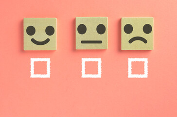 Feedback Emoticon with check block use for Customer Experience over pink pastel background.,Service rating, satisfaction,Evaluation,Increase rating concept