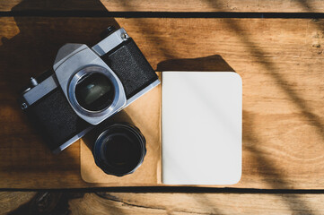 Top view of Open blank notebook on old wood background