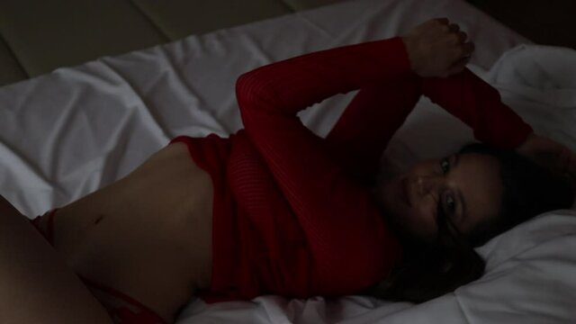 Dreamy alluring woman in red lingerie