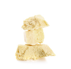 Pieces of cocoa butter on white background