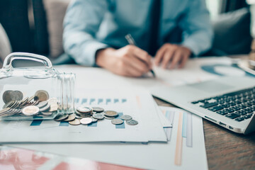 coins in jar growing, saving money for finance accounting concept.