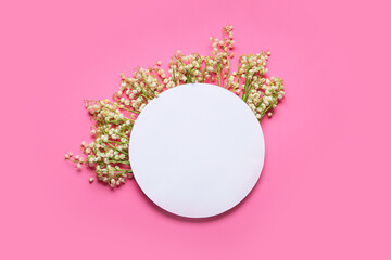 Blank card and beautiful lily-of-the-valley flowers on color background