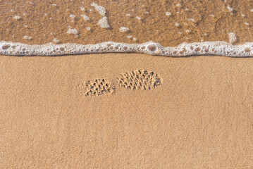 Soft wave of the sea on the sandy beach.Soft focus,blurred image.