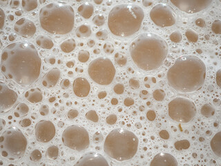 Close-up of macro foam bubbles artistic bokeh blur.