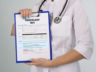 Healthcare concept about TOXICOLOGY TEST with phrase on the sheet. - obrazy, fototapety, plakaty