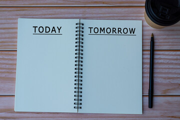 Today tomorrow text written on notepad with pen and cup of disposable coffee