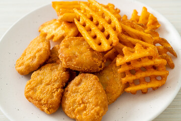 fried chicken nuggets with fried potatoes