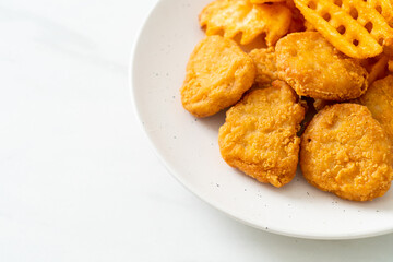 fried chicken nuggets with fried potatoes