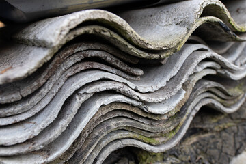 Pile of Old Asbestos cement Roof Sheets. Asbestos in Old Building Materials. Dangerous Building