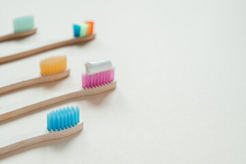 Multicolored eco friendly bamboo toothbrushes, dental care with zero waste concept, sustainable lifestyle