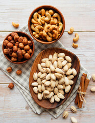 Bowls with various  nuts on a table