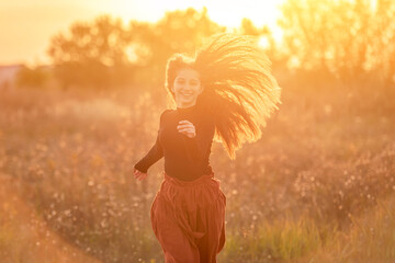 Smiling teenage girl on autumn field
