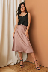 Fototapeta premium Portrait of pretty young caucasian woman with light natural make up on the background of white wall at home