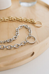 jewelry bijouterie gold silver chains handmade hobby lies on the table by the window on a wooden tray necklace necklace