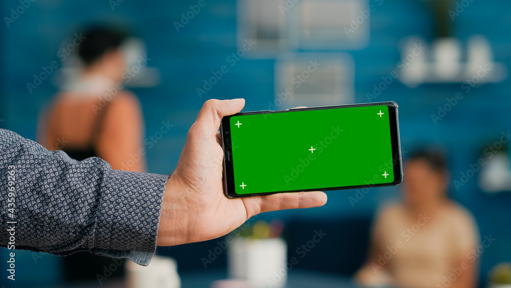 Poster front view of horizontal isolated mock up green screen chroma key display of modern smartphone. busi