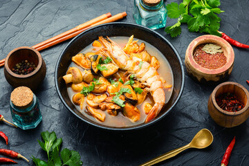 Tom yum soup with seafood and coconut milk