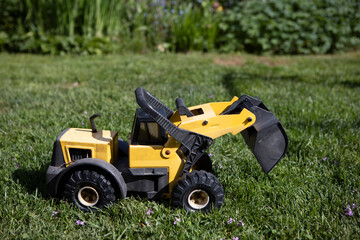 Miniature Heavy Bulldozer At Garden