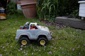 Miniature White Jeep SUV At Garden