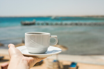 Female hands holding cup of coffee. Good morning sunrise concept. Lets start a new day. Space for text