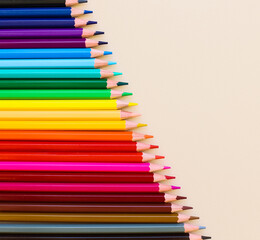 Set of colorful pencil. Color pencils isolated on beige background. Back to school items. Template design for presentation, publications, education.Children use these pencils as home activities.