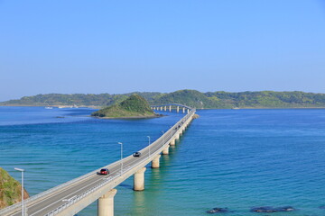 Fototapeta na wymiar Tsunoshima Ohashi Bridge in the blue ocean