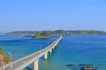 Fototapeta na wymiar Tsunoshima Ohashi Bridge in the blue ocean