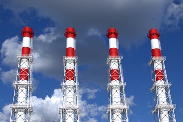 Red and white boiler room pipes against the sky