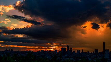 The high angle background of the city view with the secret light of the evening, blurring of night lights, showing the distribution of condominiums, dense homes in the capital community