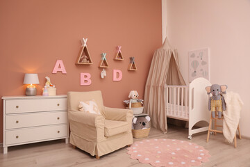 Baby room interior with stylish furniture and comfortable crib © New Africa