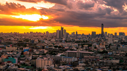 The high angle background of the city view with the secret light of the evening, blurring of night lights, showing the distribution of condominiums, dense homes in the capital community