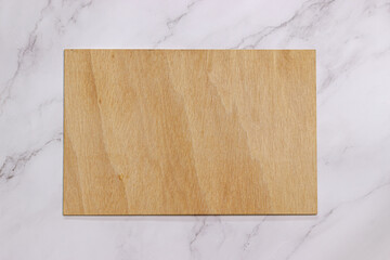 Wooden board mockup on white marble table background