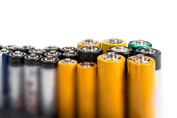 AA and AAA batteries on a white background