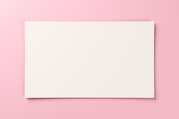 Blank white gift card on pastel pink background with copy space. 3D rendering
