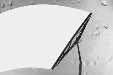 Car windshield wiper cleaning water drops from glass