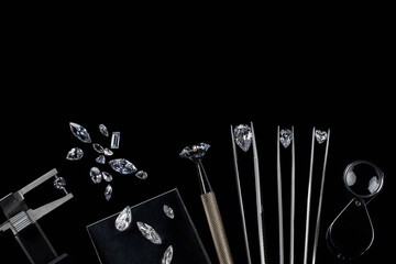 Diamonds of different sizes at the workplace of diamond dealer evaluating polished diamonds. High quality photo