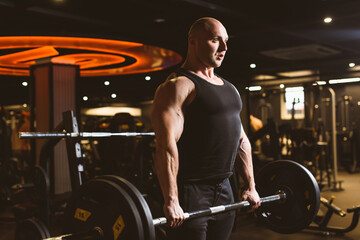 Fototapeta na wymiar Caucasian muscular athletic man doing deadlift with heavy barbell. Moment of lifting weight. Healhy lifestyle, fitness, crossfit and bodybuilding