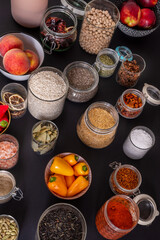 Group of uncovered glass containers filled with products for making sophisticated emotional techno cooking recipes